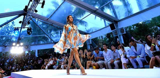 A model walks the runway at the Aqua di Lara show. (Photo by Andrew H. Walker/Getty Images for Mercedes-Benz Fashion Week Swim 2014)