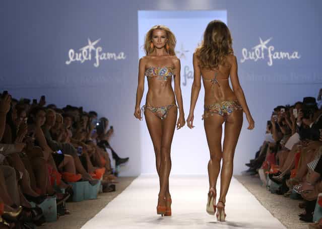 Models walks the runway during the Luli Fama show at Mercedes-Benz Fashion Week Swim, Sunday, July 21, 2013, in Miami Beach, Fla. (Photo by Lynne Sladky/AP Photo)