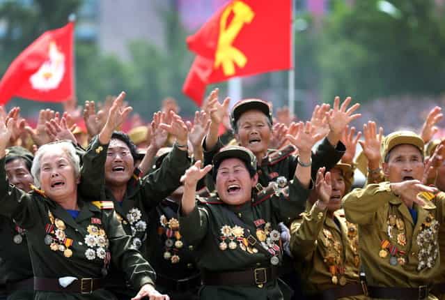 North Korean war veterans cry as they parade past their leader Kim Jong Un, Saturday, July 27, 2013 during a mass military parade celebrating the 60th anniversary of the Korean War armistice in Pyongyang, North Korea. (Photo by Wong Maye-E/AP Photo)