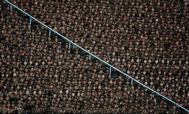 North Korean soldiers clap as they listen to President of the Presidium of the Supreme People's Assembly of North Korea Kim Yong-nam deliver a speech at the stadium. (Photo by Jason Lee/Reuters)