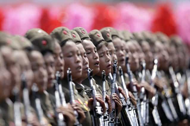 Female North Korean soldiers parade to mark the 60th anniversary of the signing of a truce in the 1950-1953 Korean War at Kim Il-sung Square, in Pyongyang. (Photo by Jason Lee/Reuters)