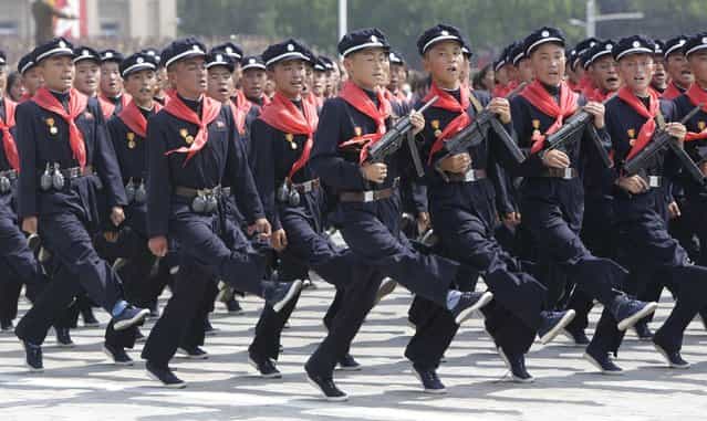 North Korean pioneers march in Pyongyang to mark the 60th anniversary of the Korean war armistice. (Photo by Reuters)