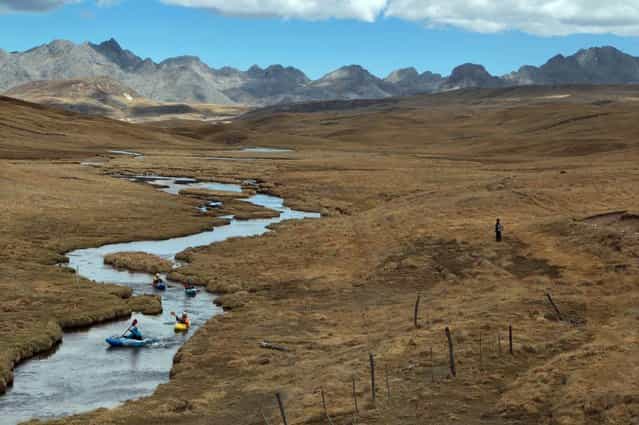 August 19, 2012 – Alpamarca, Peru – Amazon Express white water members Juan Antonio De Ugarte, of Peru, Rafael Ortiz, of Mexico, West Hansen, of the U.S., and Tino Specht, of the U.S., paddle down the Rio Gashan after leaving Lago Acucocha. Lago Acucocha is possibly the dry season source of the Amazon River. (Photo by Erich Schlegel/zReportage via ZUMA Press)
