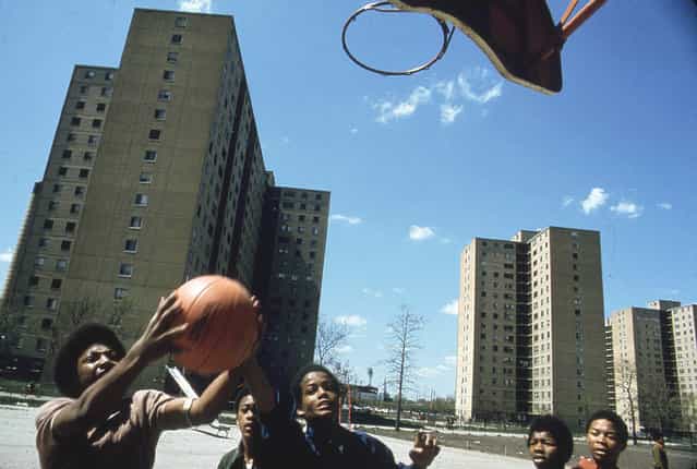 Youths play basketball at Stateway Gardens highrise housing project on the South Side, May 1973. (Photo by John H. White/NARA via The Atlantic)