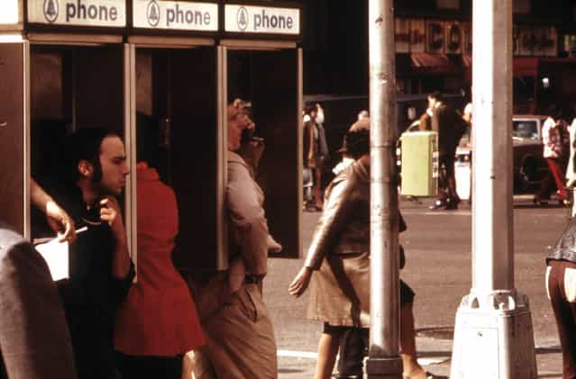 Public pay phone stalls in use at Broadway and 34th Street, in May of 1973. The first handheld mobile phone call in history was made one month prior to this photo, in midtown Manhattan, in April 1973, when Martin Cooper, a Motorola researcher made a call to his chief competitor Dr. Joel S. Engel, head of Bell Labs. (Photo by Erik Calonius/NARA via The Atlantic)