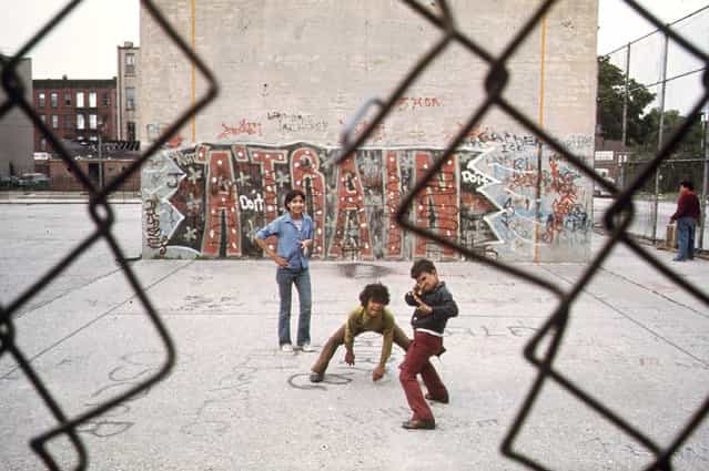 Children play in front of [A Train] graffiti in Brooklyn's Lynch Park, in June of 1974. (Photo by Danny Lyon/NARA via The Atlantic)