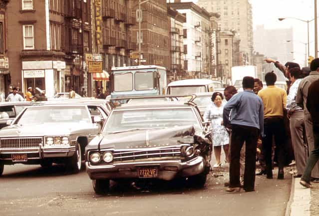A traffic accident on a crowded street in Harlem, in May of 1973. (Photo by Chester Higgins/NARA via The Atlantic)