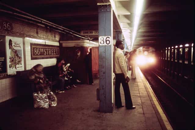 Passengers wait for a Lexington Avenue Line subway train on one of the platforms of the New York City Transit Authority, April, 1974. (Photo by Jim Pickerell/NARA via The Atlantic)