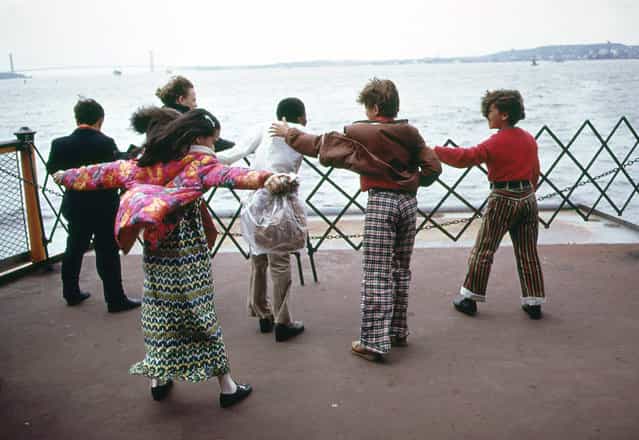 Students play in the wind during a school excursion on the Staten Island Ferry, crossing upper New York Bay, in June of 1973. (Photo by Arthur Tress/NARA via The Atlantic)