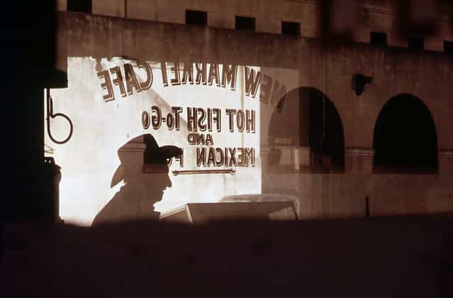 Customer's shadow reflected in window of New Market Cafe in the old Mexican market area of San Antonio, in November of 1972. (Photo by Bob Smith/NARA via The Atlantic)