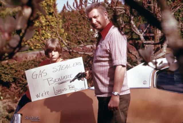 The country's fuel shortage led to problems for motorists in finding gas as well as paying much more for it, and resulted in theft from cars left unprotected. This Portland father and son made a sign warning thieves of the possible consequences, April 1974. (Photo by David Falconer/NARA via The Atlantic)