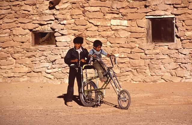 Boys play on a bicycle on the Hopi Reservation in Arizona, in 1972. (Photo by Terry Eiler/National Archives and Records Administration via The Atlantic)