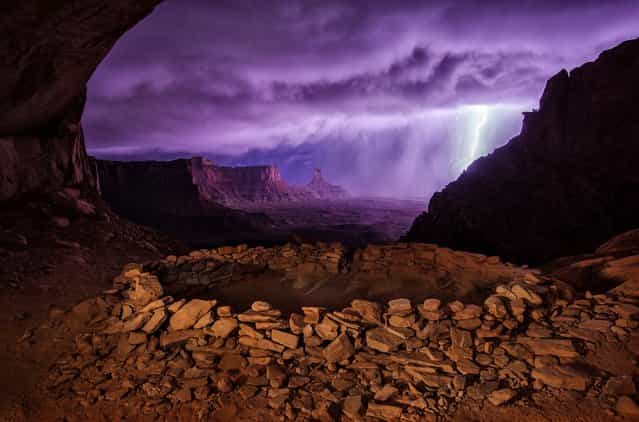 Second Place Winner: [Thunderstorm at False Kiva]. I hiked out to these ruins at night hoping to photograph them with the Milky Way, but instead a thunderstorm rolled through, creating this dramatic image. – Max Seigal. National Geographic Traveler Director of Photography Dan Westergren, one of this year's judges, shares his thoughts on the second place winner: [This photo combines two different scenes into one: the small kiva in a cliff dwelling and the grand vista of Canyonlands National Park across the valley. I really like the two different color palettes – warm inside and purple outside. This two-for-one scene was caused by the lightning storm outside the dwelling, which lit up the landscape like it was a huge electronic flash. Looking at this picture I can imagine what a wonderful sight it must have been for the ancient people who lived here. It doesn't seem too amazing now in our modern world, but might have been mind-blowing for the prehistoric residents]. Location: Utah. (Photo and caption by Max Seigal/National Geographic Traveler Photo Contest)