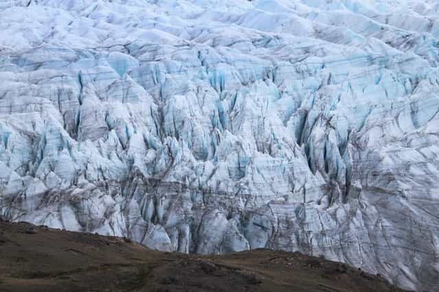 A glacier is seen on July 13, 2013 in Kangerlussuaq, Greenland. (Photo by Joe Raedle/Getty Images via The Atlantic)