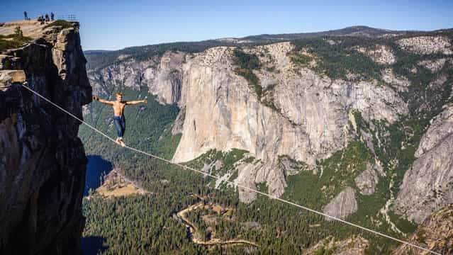 Photographer: Alexandre Buisse. Athlete: Mich Kemeter. Location: Taft Point, Yosemite, California. (Photo by Alexandre Buisse/Red Bull Illume via The Atlantic)