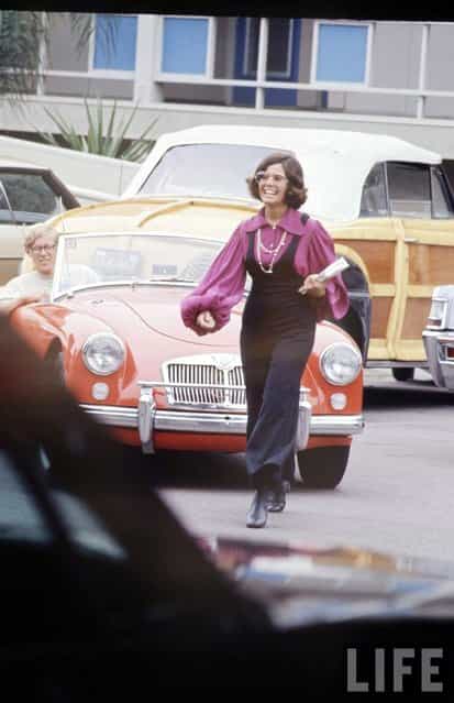 High schooler Lenore Reday stops traffic while wearing a bell-bottomed jump suit in Newport Beach, Calif., 1969. (Photo by Arthur Schatz/Time & Life Pictures/Getty Images)