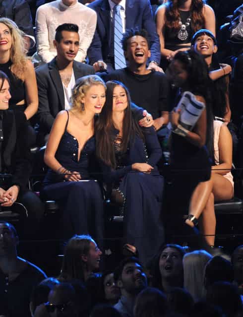 Taylor Swift, center left, and Selena Gomez sit together at the MTV Video Music Awards on Sunday, August 25, 2013, at the Barclays Center in the Brooklyn borough of New York. (Photo by Scott Gries/AP Photo/Invision)