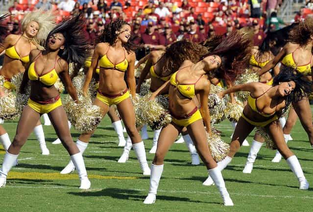 Washington Redskins cheerleaders perform before a preseason game against the Buffalo Bills in Landover, Md. (Photo by Richard Lipski/Associated Press)