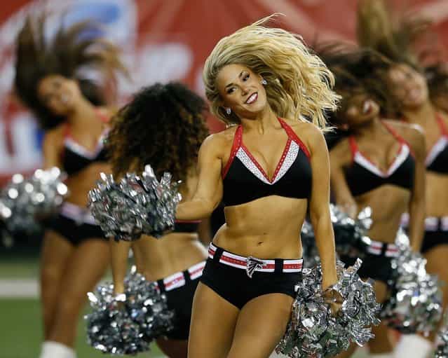 The Atlanta Falcons cheerleaders perform during a game against the Cincinnati Bengals at the Georgia Dome in Atlanta. (Photo by Kevin C. Cox/Getty Images)