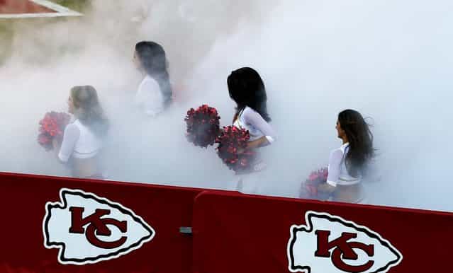 Kansas City Chiefs cheerleaders prepare to perform during a preseason game against the San Francisco 49ers at Arrowhead Stadium in Kansas City. (Photo by Orlin Wagner/Associated Press)