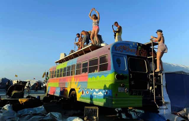 A band plays on top of a bus. (Photo by Andy Barron/The Reno Gazette-Journal)