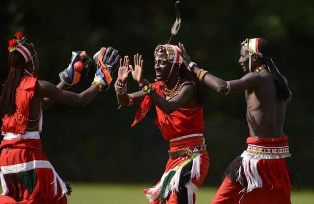 Nissan Jonathan Ole Meshami (C) of the Maasai Cricket Warriors team from Kenya is congratulated after a dismissal by teammates in a match against English team [The Shed] during [The Last Man Stands] cricket tournament at Dulwich sports ground in South London September 1, 2013. (Photo by Philip Brown/Reuters)