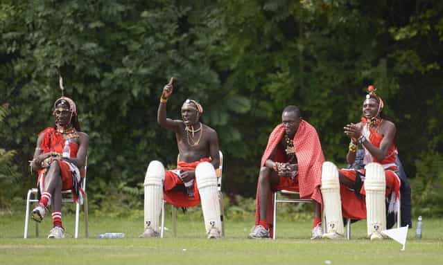 Members of the Maasai Cricket Warriors team from Kenya watch their match against English team [The Shed], during the [Last Man Stands] cricket tournament at Dulwich sports ground in South London September 1, 2013. (Photo by Philip Brown/Reuters)