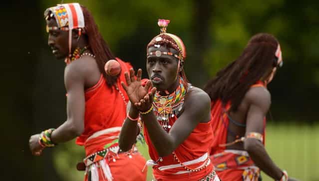 Tepele Francis Siranga Naimando (C) of the Maasai cricket warriors team from Kenya catches a ball before a cricket match against English team [The Shed] during the [Last Man Stands] cricket tournament at Dulwich sports ground in South London September 1, 2013. (Photo by Philip Brown/Reuters)