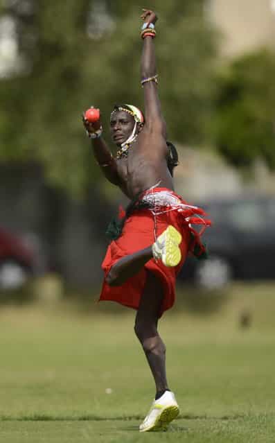 Sonyanga Ole Ngais of the Maasai cricket warrior team from Kenya bowls during a cricket match against English team [The Shed] during the Last Man Stands cricket tournament at Dulwich sports ground in south London September 1, 2013. (Photo by Philip Brown/Reuters)