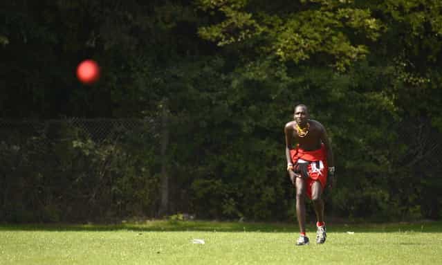 Takare Njayo Thomas Ole Meshami of the Maasai Cricket Warriors team from Kenya watches the ball in a match against English team [The Shed] during [The Last Man Stands] cricket tournament at Dulwich sports ground in South London September 1, 2013. (Photo by Philip Brown/Reuters)