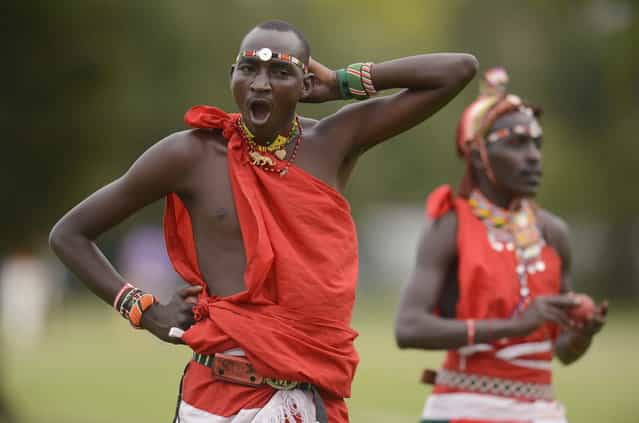 Members of the Maasai Cricket Warriors team from Kenya warm up before a match against English team [The Shed] during the [Last Man Stands] cricket tournament at Dulwich sports ground in South London September 1, 2013. (Photo by Philip Brown/Reuters)