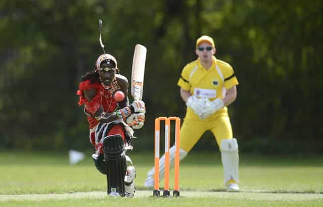 Nissan Jonathan Ole Meshami (L) of the Maasai Cricket Warriors team from Kenya hits the ball during a match against English team [The Shed], during the [Last Man Stands] cricket tournament at Dulwich sports ground in South London September 1, 2013. (Photo by Philip Brown/Reuters)