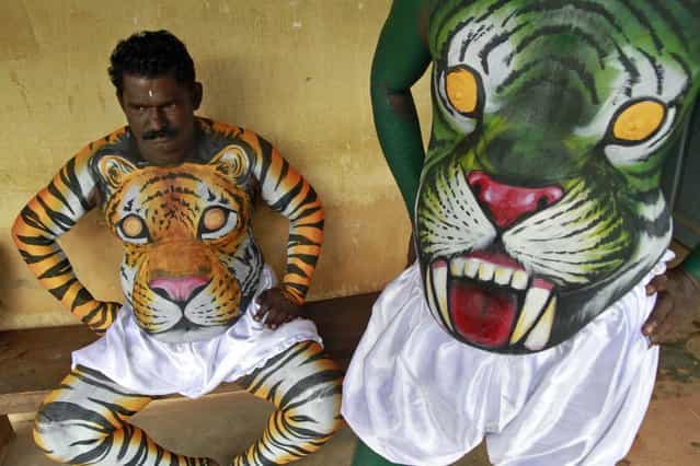 Dancers in body paint wait to take part in a performance during festivities marking the start of the annual harvest festival of [Onam] in the southern Indian city of Kochi September 7, 2013. The ten-day-long Hindu festival is celebrated annually in India's southern coastal state of Kerala to commemorate the return of King Mahabali to his beloved subjects. (Photo by Sivaram V/Reuters)
