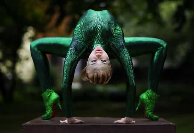 Russian-born contortionist Zlata poses during a photo shooting in a park in Bergisch Gladbach, Germany, 09 September 2013. The international contortionists conference takes place in the city from 09 until 11 September with 100 partcipants from 16 countries. (Photo by Rolf Vennenbernd/EPA)