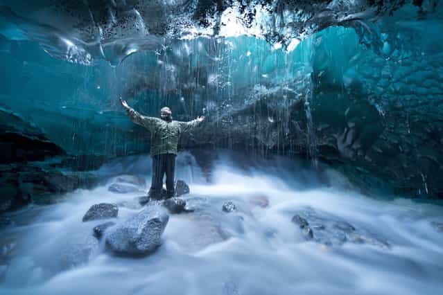 A brave photographer risked his life venturing into a cave below a glacier to capture these scenes, which look like something from the Ice Age in Alaska, on September 10, 2013. (Photo by Photoshelter)