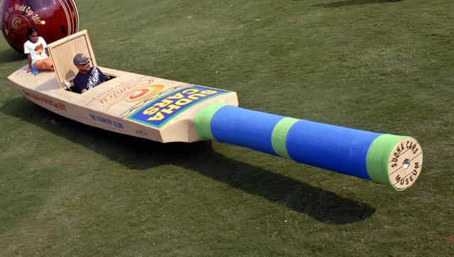 Sudhakar Yadav, an Indian rides a cricket bat shaped car in the southern Indian city of Hyderabad March 10, 2007. A 25 feet long cricket bat shaped car is to support team India in the world cup cricket, Yadav said. (Photo by Krishnendu Halder/Reuters)
