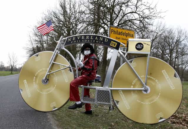 German bicycle designer Didi Senft, poses in a costume with a self-made bike honouring the late U.S. singer Michael Jackson in the village of Philadelphia near Storkow, some 50 km (31 miles) south of the German capital Berlin, April 6, 2010. Senft, a cycling fan better known as [El Diablo] from the Tour de France, is to embark on a 13-day tour with his bike, visiting capitals around Europe to pay tribute to Michael Jackson. (Photo by Thomas Peter/Reuters)