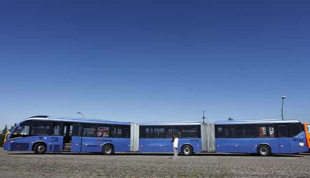 A view of what the Curitiba City Hall is calling the world's longest articulated bus, as it was presented to the press before going into service on the city's public transportation grid, in Curitiba April 5, 2011. The bus, made in Brazil by Volvo with a Neobus chassis, has a capacity of 250 passengers, is 28 meters (92 ft) long, 2.6 meters (8.5 ft) wide, and powered with biodiesel made from soybeans. (Photo by Rodolfo Buhrer/Reuters)