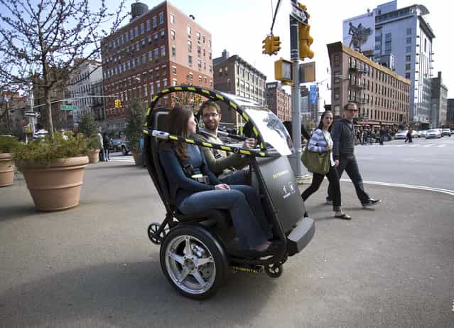 The Project P.U.M.A. prototype is shown during a test drive in Brooklyn, New York April 4, 2009. General Motors and Segway are developing an electric two-seat prototype vehicle with just two wheels, which could allow people to travel around cities more quickly, safely, quietly and cleanly, and at a lower total cost. The collaboration, dubbed Project P.U.M.A. (Personal Urban Mobility and Accessibility) combines several technologies that increase mobility freedom with zero emissions, enhanced safety, seamless connectivity and reduced congestion in cities. (Photo by Reuters/Emile Wamsteker-General Motors)