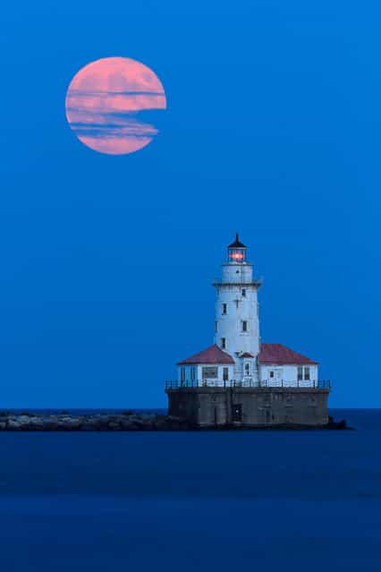 Photographer Katherine Gendreau writes on Flickr: [Finally accomplished a longtime goal of mine, to shoot a full moon rising over a lighthouse! This is the Chicago Harbor Light from the Navy Pier]. (Photo by Katherine Gendreau)