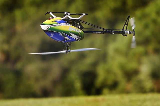 A T-Rex 600 Efl remote control helicopter flown by Jeff Polisena of West Palm Beach does acrobatic maneuvers at Phil Wherry Field. (Photo by Bill Ingram/The Palm Beach Post)