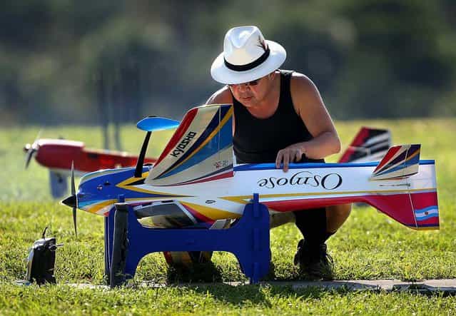 Julius Lee prepares a Kyosho Acrobatic Osmose plane. (Photo by Bill Ingram/The Palm Beach Post)