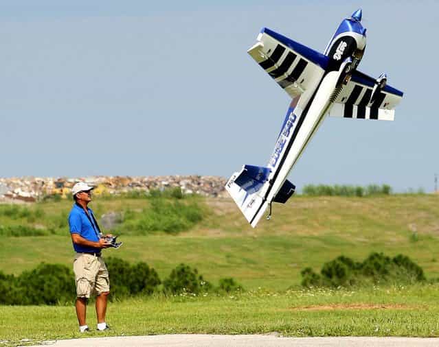 Rembert does a stall maneuver with a 1/4 scale gas powered DH 540 over Phil Wherry Field. (Photo by Bill Ingram/The Palm Beach Post)