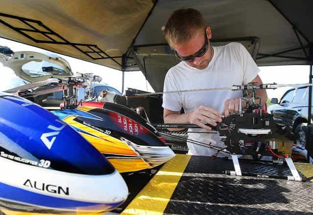 Phil Dettman prepares one of his electric flybarless 3-axis gyro helicopters. (Photo by Bill Ingram/The Palm Beach Post)