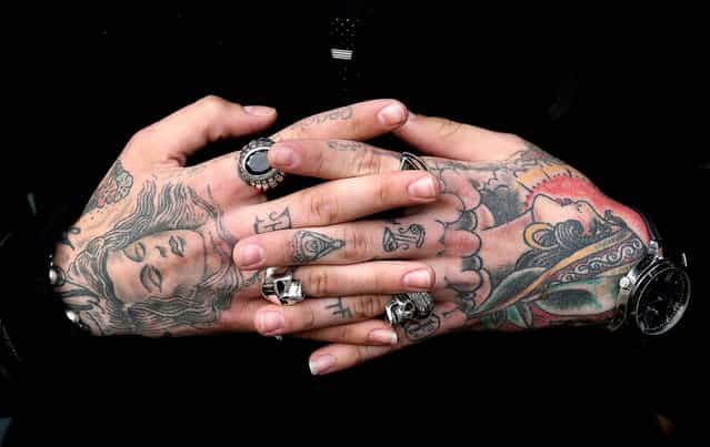 Jimmy Q's displays the tattoos on his hands. (Photo by Oli Scarff/Getty Images)