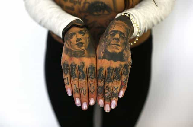Cleo displays tattoos on her hands. (Photo by Stefan Wermuth/Reuters)