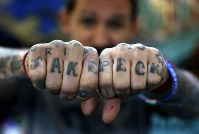 Oliver displays tattoos on his hands. (Photo by Stefan Wermuth/Reuters)