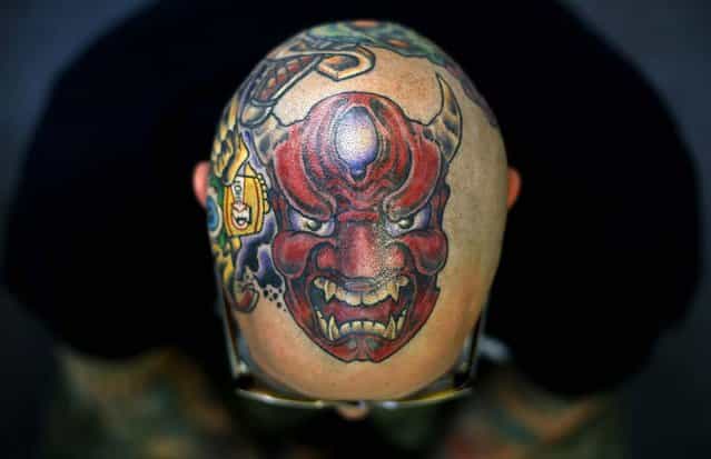 Matt Grosso displays a tattoo on his head. (Photo by Stefan Wermuth/Reuters)