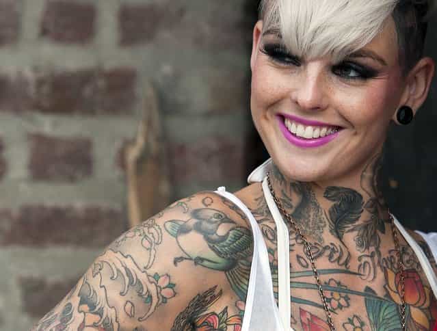 A tattoo enthusiast poses at the London Tattoo Convention in London on September 29, 2013. (Photo by Oli Scarff/Getty Images)