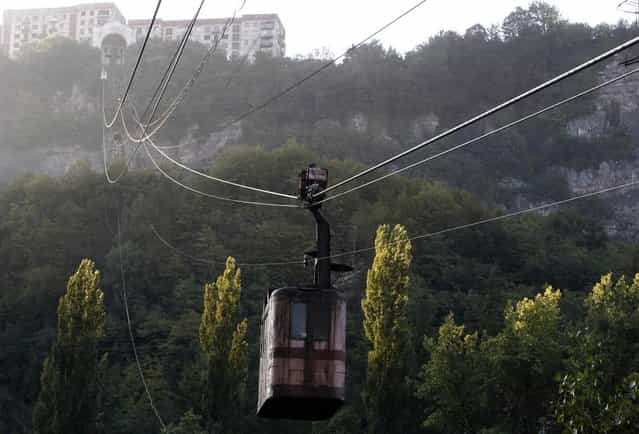 A 60-year-old cable car passes above the town of Chiatura, some 220 km (136 miles) northwest of Tbilisi, September 12, 2013. (Photo by David Mdzinarishvili/Reuters)